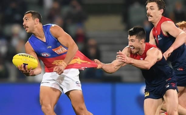 Nakia Cockatoo of the Lions caught by Alex Neal-Bullen of the Demons during the AFL First Qualifying Final match between Melbourne Demons and...