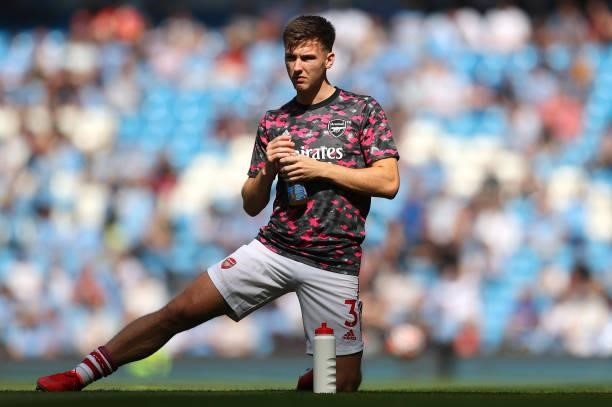 Kieran Tierney of Arsenal warms up prior to the Premier League match between Manchester City and Arsenal at Etihad Stadium on August 28, 2021 in...