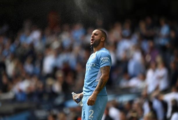 Kyle Walker of Manchester City refreshes prior to the Premier League match between Manchester City and Arsenal at Etihad Stadium on August 28, 2021...