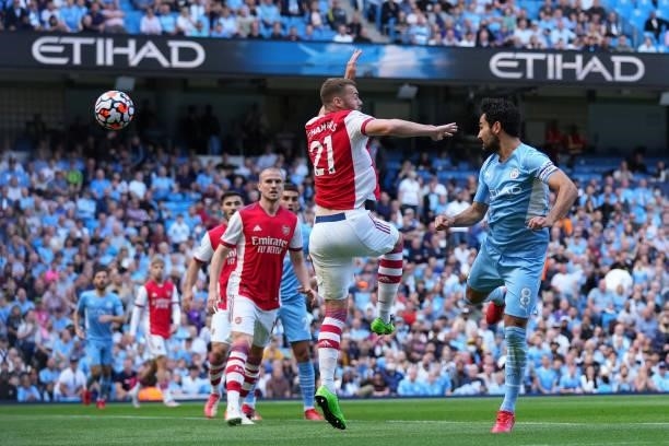 Ilkay Gundogan of Manchester City scores his team's first goal during the Premier League match between Manchester City and Arsenal at Etihad Stadium...
