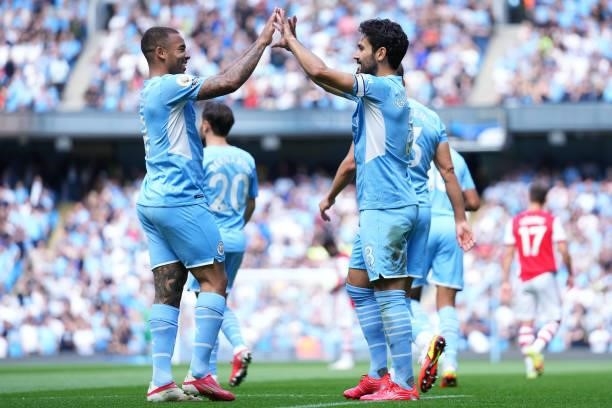 Ilkay Gundogan of Manchester City celebrates with teammate Gabriel Jesus after scoring his team's first goal during the Premier League match between...