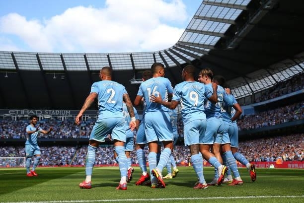 Ferran Torres of Manchester City celebrates with teammates after scoring his team's second goal during the Premier League match between Manchester...