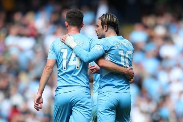Aymeric Laporte and Jack Grealish of Manchester City celebrate after their team's first goal during the Premier League match between Manchester City...