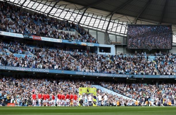 Players of Manchester City and Arsenal line up ahead of the Premier League match between Manchester City and Arsenal at Etihad Stadium on August 28,...