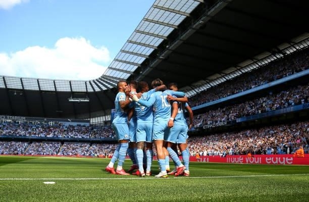 Ferran Torres of Manchester City celebrates with teammates after scoring his team's second goal during the Premier League match between Manchester...