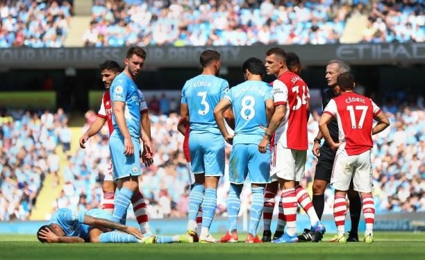 Granit Xhaka of Arsenal reacts towards Joao Cancelo of Manchester City prior to being sent off by referee Martin Atkinson during the Premier League...