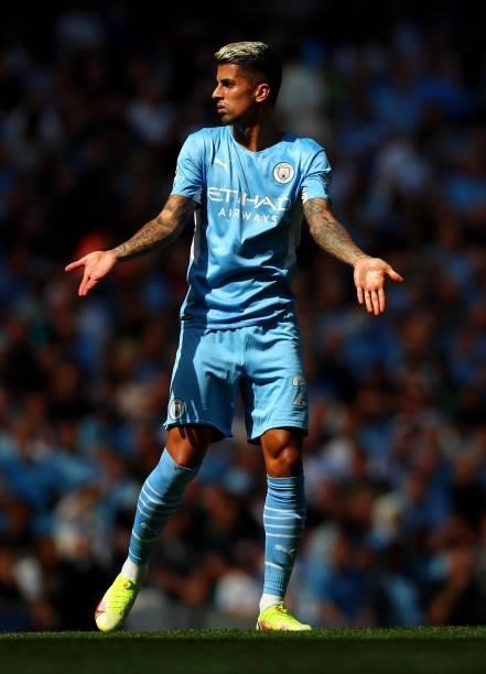 Joao Cancelo of Manchester City gestures during the Premier League match between Manchester City and Arsenal at Etihad Stadium on August 28, 2021 in...