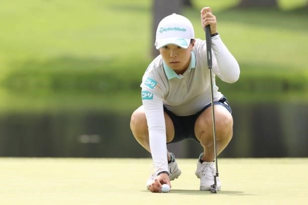 Saki Nagamine of Japan lines up her putt on the 2nd hole during the third round of the Nitori Ladies at Otaru Country Club on August 28, 2021 in...