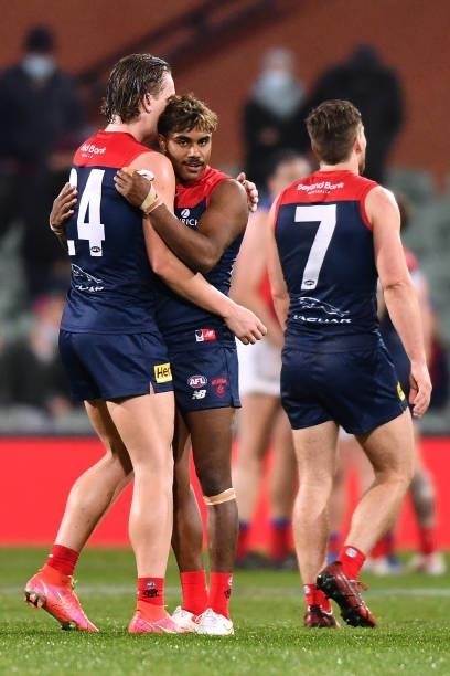Trent Rivers of the Demons hugs Kysaiah Pickett of the Demons after the final siren during the AFL First Qualifying Final match between Melbourne...