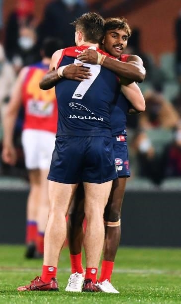 Jack Viney of the Demons hugs Kysaiah Pickett of the Demons after the final siren during the AFL First Qualifying Final match between Melbourne...