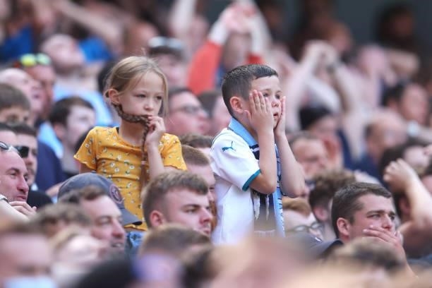 Manchester City fans react during the Premier League match between Manchester City and Arsenal at Etihad Stadium on August 28, 2021 in Manchester,...