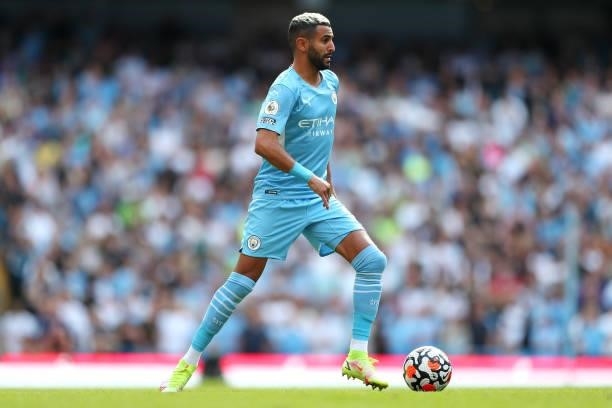 Riyad Mahrez of Manchester City runs with the ball during the Premier League match between Manchester City and Arsenal at Etihad Stadium on August...
