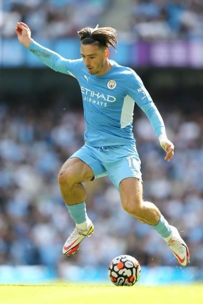 Jack Grealish of Manchester City runs with the ball during the Premier League match between Manchester City and Arsenal at Etihad Stadium on August...