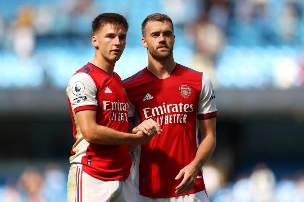 Kieran Tierney and Calum Chambers of Arsenal interact during the Premier League match between Manchester City and Arsenal at Etihad Stadium on August...