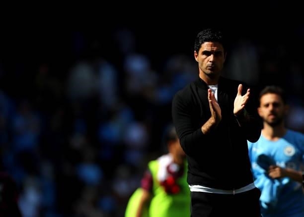 Arsenal Manager Mikel Arteta applauds the fans after the Premier League match between Manchester City and Arsenal at Etihad Stadium on August 28,...