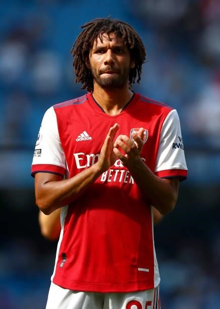 Mohamed Elneny of Arsenal applauds the fans after the Premier League match between Manchester City and Arsenal at Etihad Stadium on August 28, 2021...