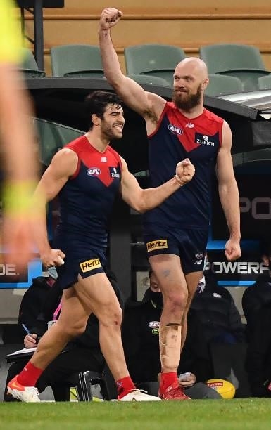 Christian Petracca of the Demons and Max Gawn of the Demons celebrate the final siren from the bench during the AFL First Qualifying Final match...