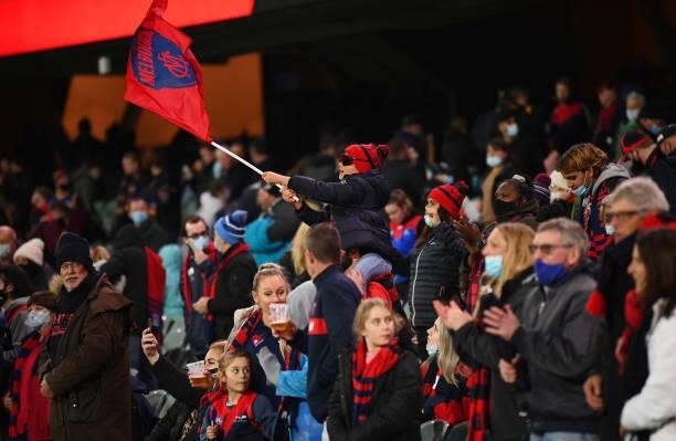 Melbourne fans celebrate the win during the AFL First Qualifying Final match between Melbourne Demons and Brisbane Lions at Adelaide Oval on August...