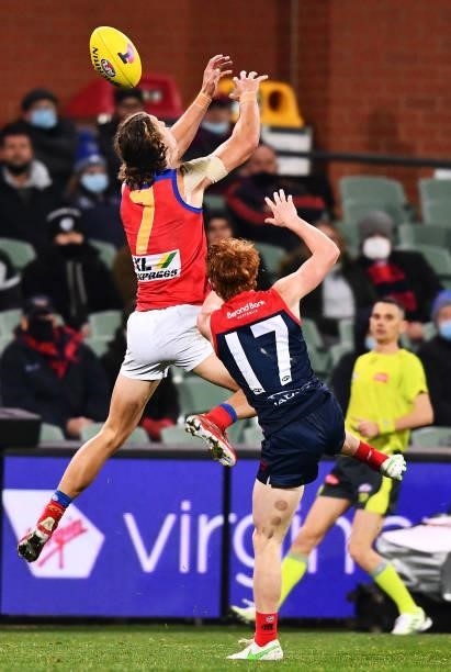 Jarrod Berry of the Lions competes for the ball against Jake Bowey of the Demons during the AFL First Qualifying Final match between Melbourne Demons...