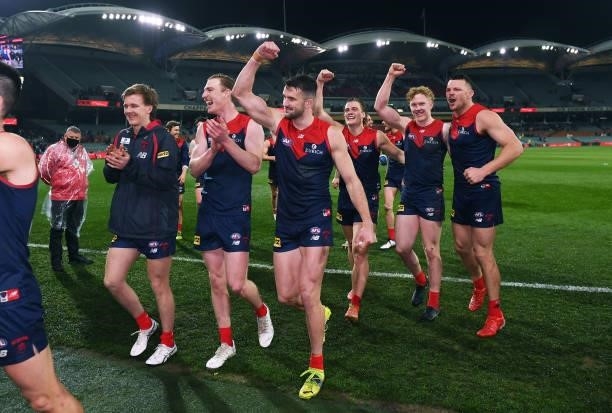 Melbourne celebrate as the head off the oval during the AFL First Qualifying Final match between Melbourne Demons and Brisbane Lions at Adelaide Oval...