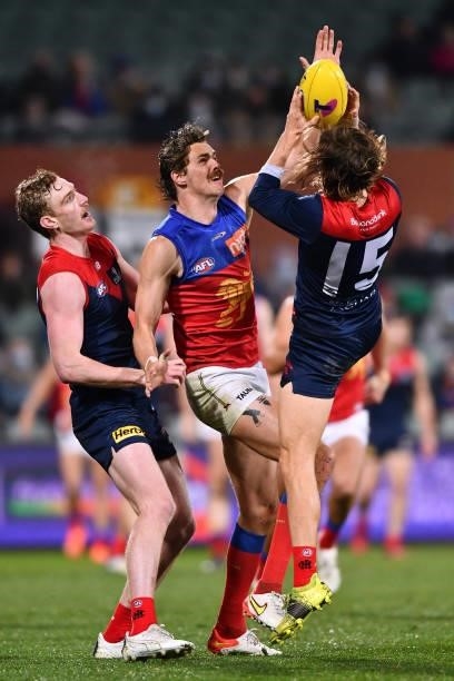 Ed Langdon of the Demons marks in front of Joe Daniher of the Lions during the AFL First Qualifying Final match between Melbourne Demons and Brisbane...