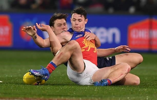 Lachie Neale of the Lions tackled by Tom Sparrow of the Demons during the AFL First Qualifying Final match between Melbourne Demons and Brisbane...