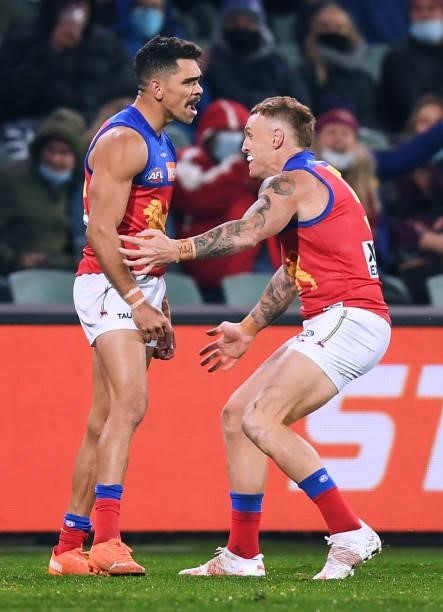 Charlie Cameron of the Lions celebrates a goal with Mitch Robinson of the Lions during the AFL First Qualifying Final match between Melbourne Demons...