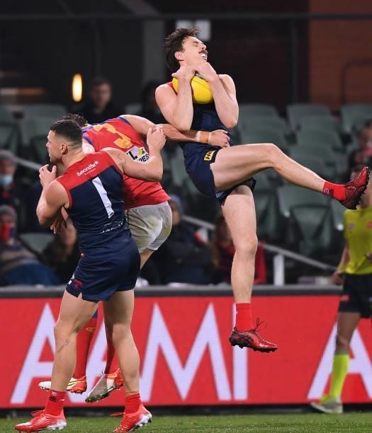 Jake Lever of the Demons marks in front of Steven May of the Demons and Joe Daniher of the Lions during the AFL First Qualifying Final match between...
