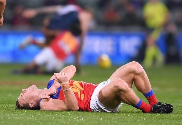 Lincoln McCarthy of the Lions in pain after a heavy knock during the AFL First Qualifying Final match between Melbourne Demons and Brisbane Lions at...