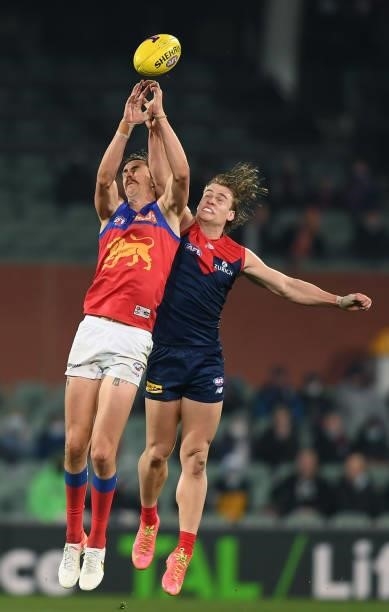 Joe Daniher of the Lions competes for the ball against Trent Rivers of the Demons during the AFL First Qualifying Final match between Melbourne...