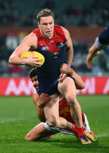 Tom McDonald of the Demons tackled by Daniel McStay of the Lions during the AFL First Qualifying Final match between Melbourne Demons and Brisbane...