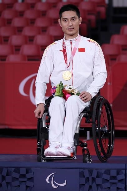 Gold medalist Panfeng Feng of Team China reacts during the medal ceremony after the Table Tennis Men's Singles Class 3 Gold Medal Match against...