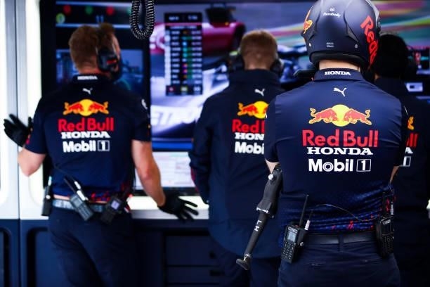 Red Bull Racing team members watch the action in the garage during qualifying ahead of the F1 Grand Prix of Belgium at Circuit de Spa-Francorchamps...
