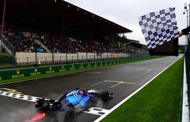 Second place qualifier George Russell of Great Britain driving the Williams Racing FW43B Mercedes takes the chequered flag during qualifying ahead of...
