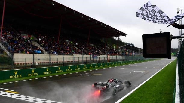 Third place qualifier Lewis Hamilton of Great Britain and Mercedes GP takes the chequered flag during qualifying ahead of the F1 Grand Prix of...