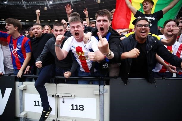 Fans of Crystal Palace react in the crowd during the Premier League match between West Ham United and Crystal Palace at London Stadium on August 28,...