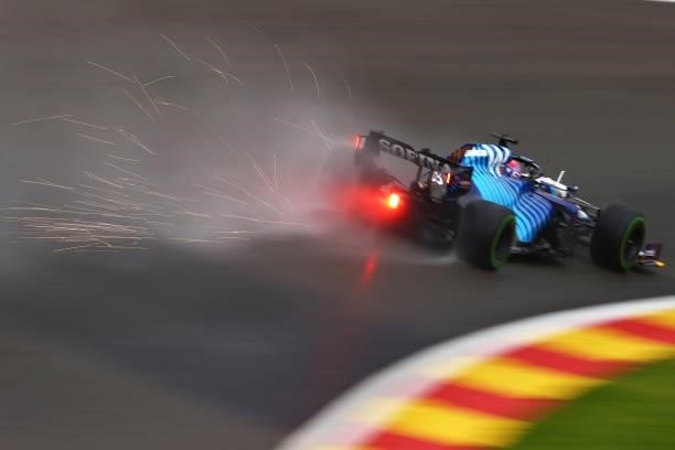 Sparks fly behind George Russell of Great Britain driving the Williams Racing FW43B Mercedes during qualifying ahead of the F1 Grand Prix of Belgium...