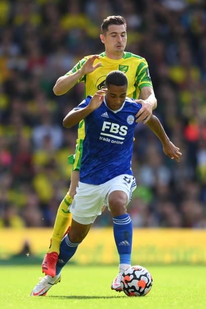 Youri Tielemans of Leicester City holds off Kenny McLean of Norwich City during the Premier League match between Norwich City and Leicester City at...