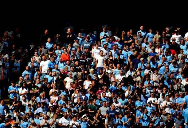 Manchester City fans look on during the Premier League match between Manchester City and Arsenal at Etihad Stadium on August 28, 2021 in Manchester,...