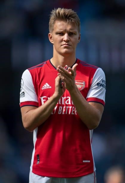 Martin Ødegaard of Arsenal applauds the fans after the Premier League match between Manchester City and Arsenal at Etihad Stadium on August 28, 2021...