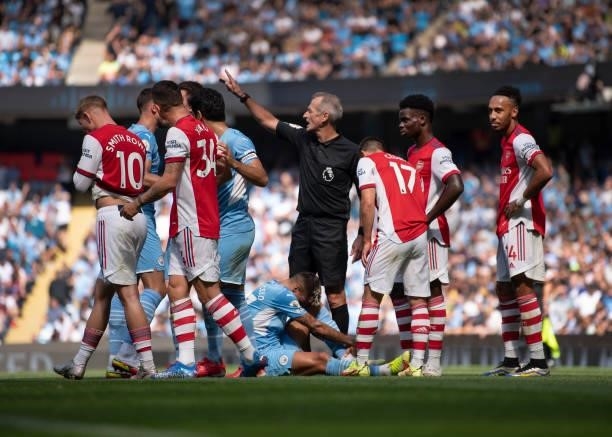Granit Xhaka of Arsenal is sent off by referee Martin Atkinson during the Premier League match between Manchester City and Arsenal at Etihad Stadium...