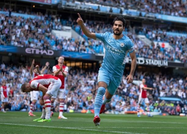 Ilkay Gündogan of Manchester City celebrates scoring the first goal during the Premier League match between Manchester City and Arsenal at Etihad...