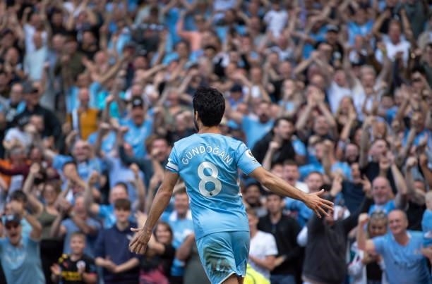 Ilkay Gündogan of Manchester City celebrates scoring the first goal during the Premier League match between Manchester City and Arsenal at Etihad...