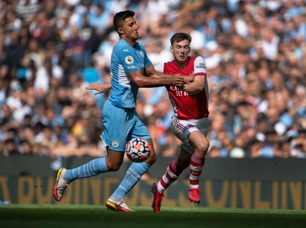 Kieran Tierney of Arsenal and Rodri of Manchester City in action during the Premier League match between Manchester City and Arsenal at Etihad...
