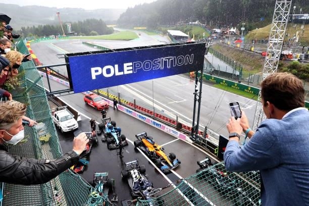 Fans watch the action as the field stops in parc ferme during qualifying ahead of the F1 Grand Prix of Belgium at Circuit de Spa-Francorchamps on...