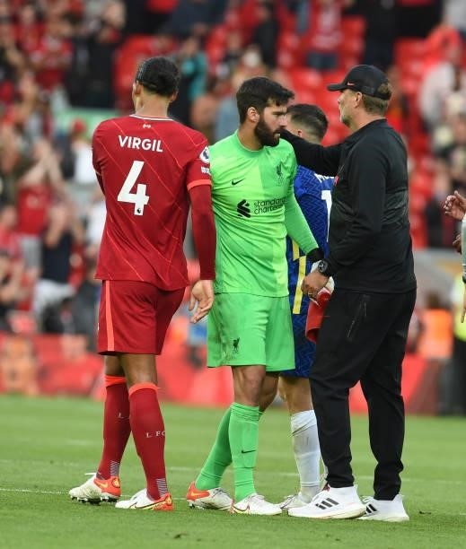 Alisson Becker of Liverpool with Jurgen Klopp manager of Liverpool at the end of the game Premier League match between Liverpool and Chelsea at...