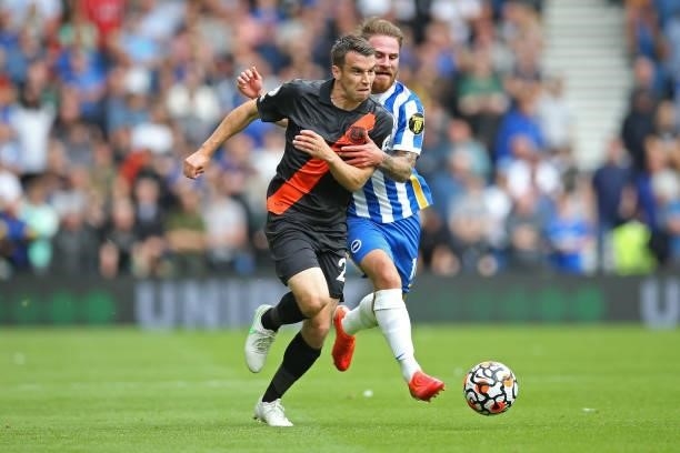 Seamus Coleman of Everton battles for possession with Alexis Mac Allister of Brighton and Hove Albion during the Premier League match between...