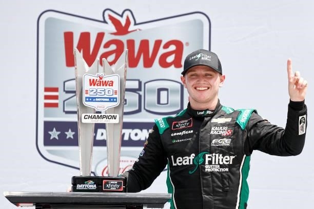 Justin Haley, driver of the LeafFilter Gutter Protection Chevrolet, celebrates in the Ruoff Mortgage victory lane after winning the NASCAR Xfinity...