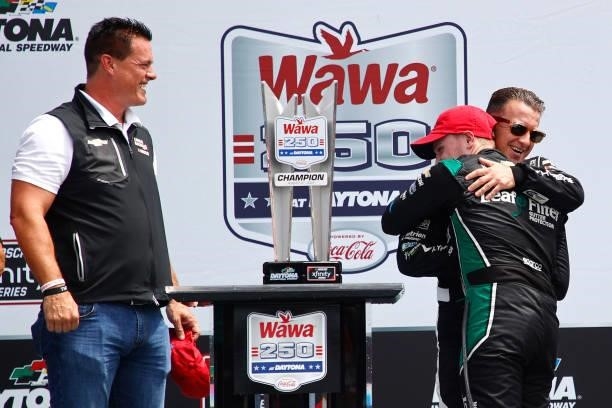 Allmendinger, driver of the Hyperice Chevrolet, congratulates Justin Haley, driver of the LeafFilter Gutter Protection Chevrolet, as Matt Kaulig,...
