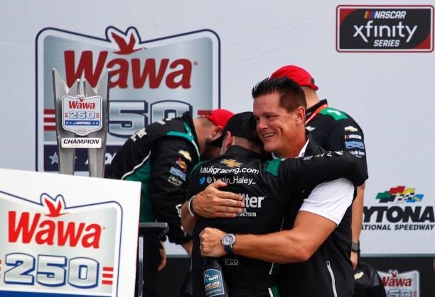 Matt Kaulig, owner of Kaulig Racing hugs Justin Haley, driver of the LeafFilter Gutter Protection Chevrolet, in the Ruoff Mortgage victory lane after...